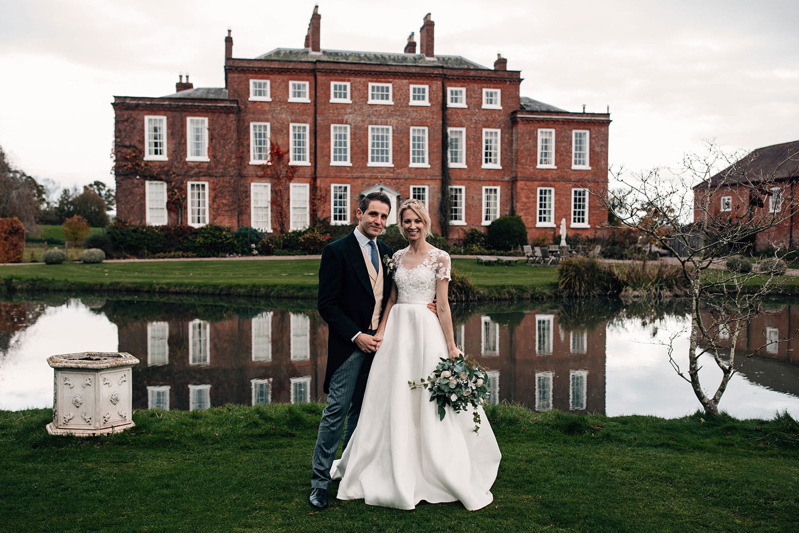 Bride and Groom in front of Delbury Hall in Shropshire