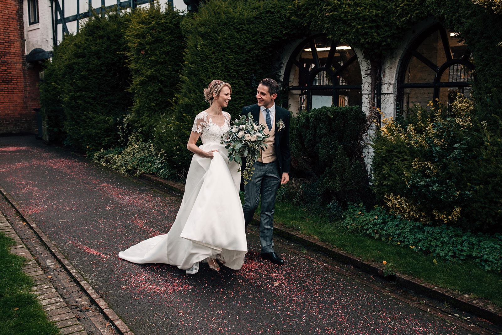 Bride and Groom celebrating their garden wedding in Much Wenlock, Shropshire