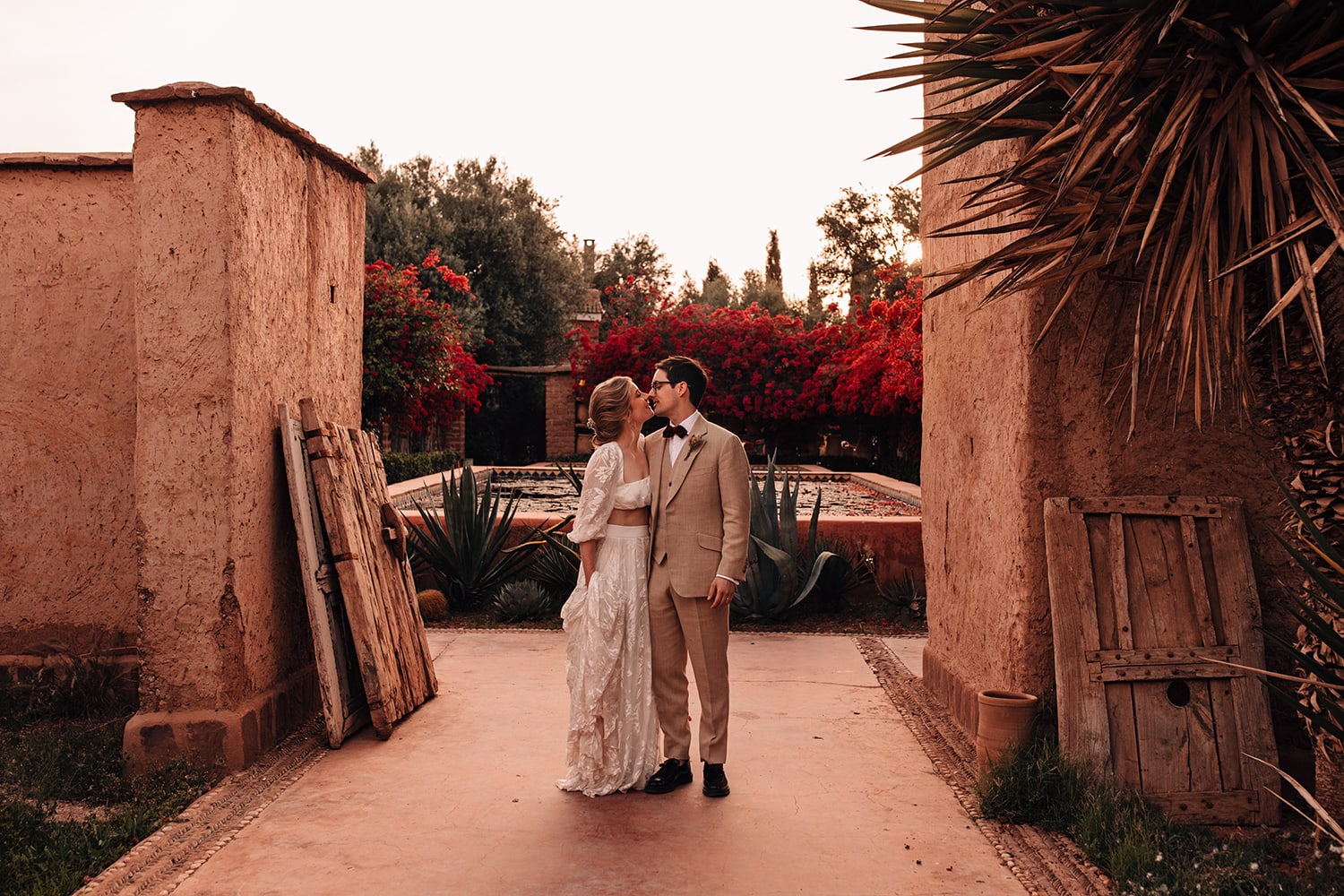 Bride dressed in Grace Loves Lace wedding dress embracing her Groom at the Beldi Country Club in Marrakesh