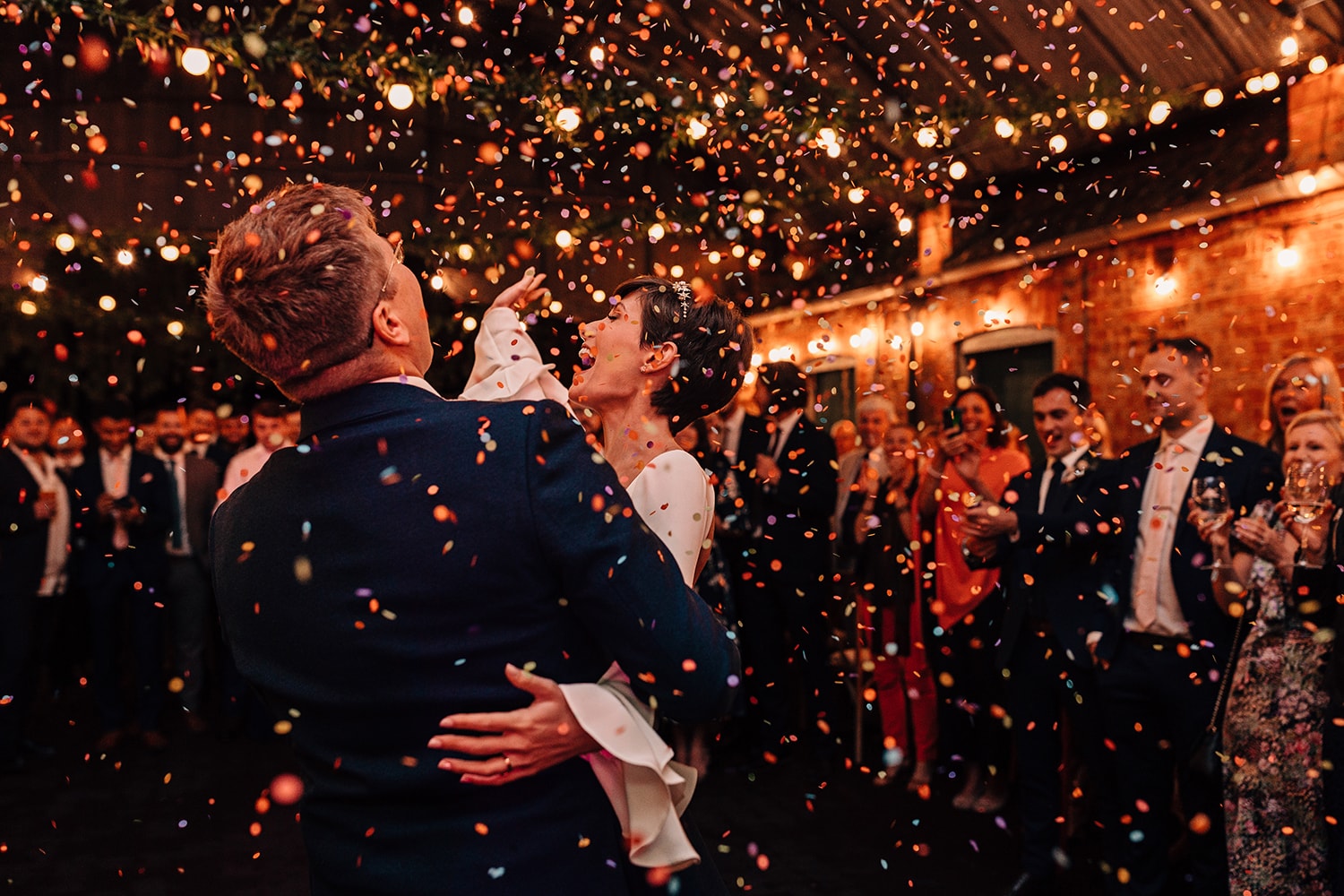 Confetti canons being used during the wedding first dance