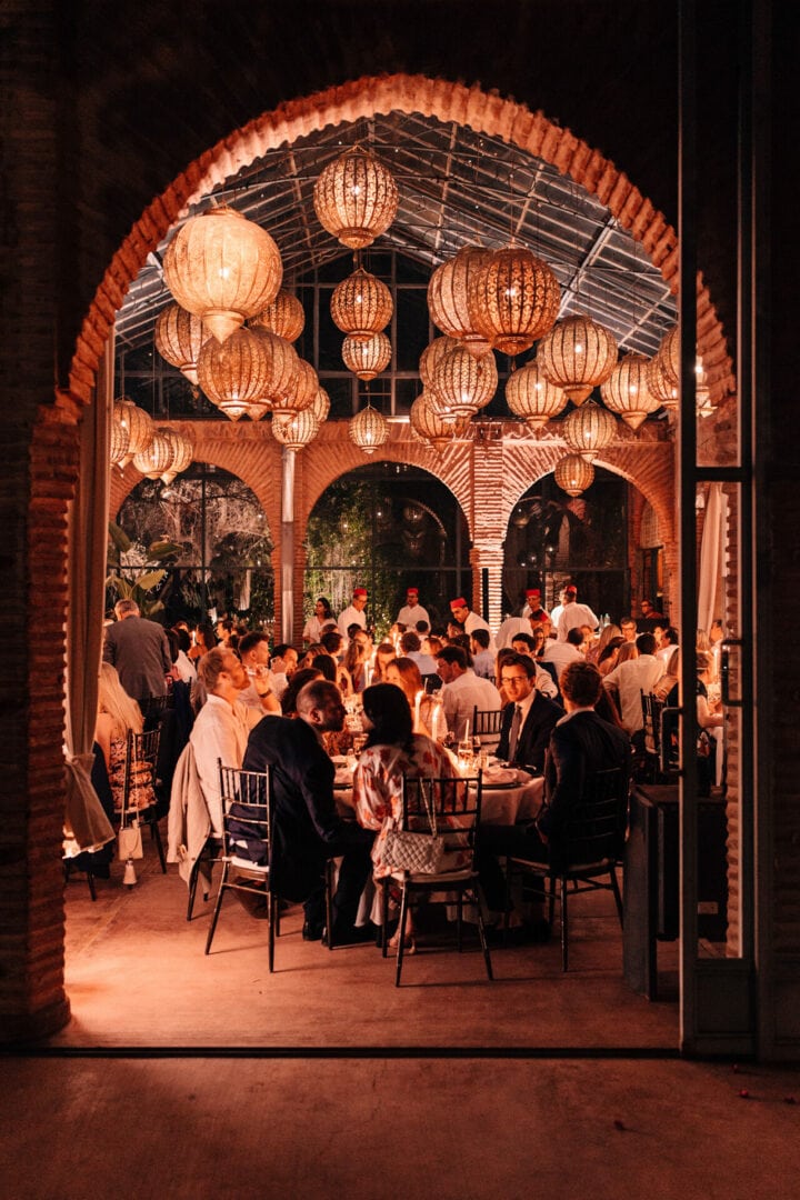 Looking in at a wedding through an arched doorway in the Beldi Country Club In Marrakesh