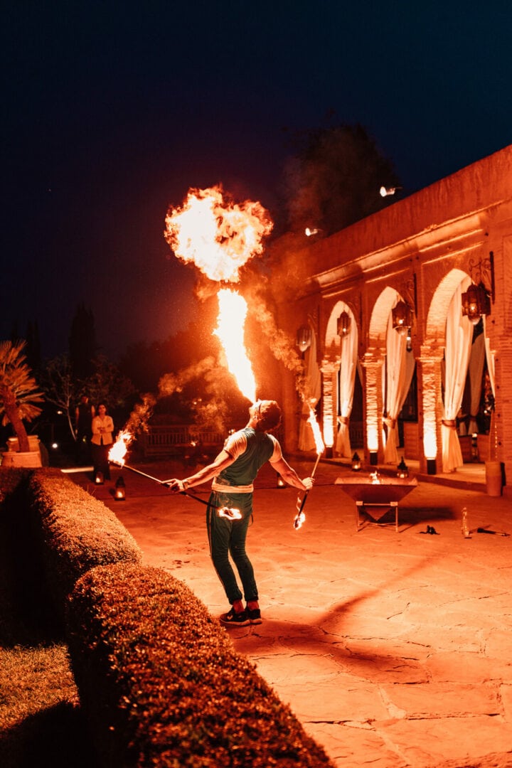 Fire breather putting on a show at a wedding in Marrakesh