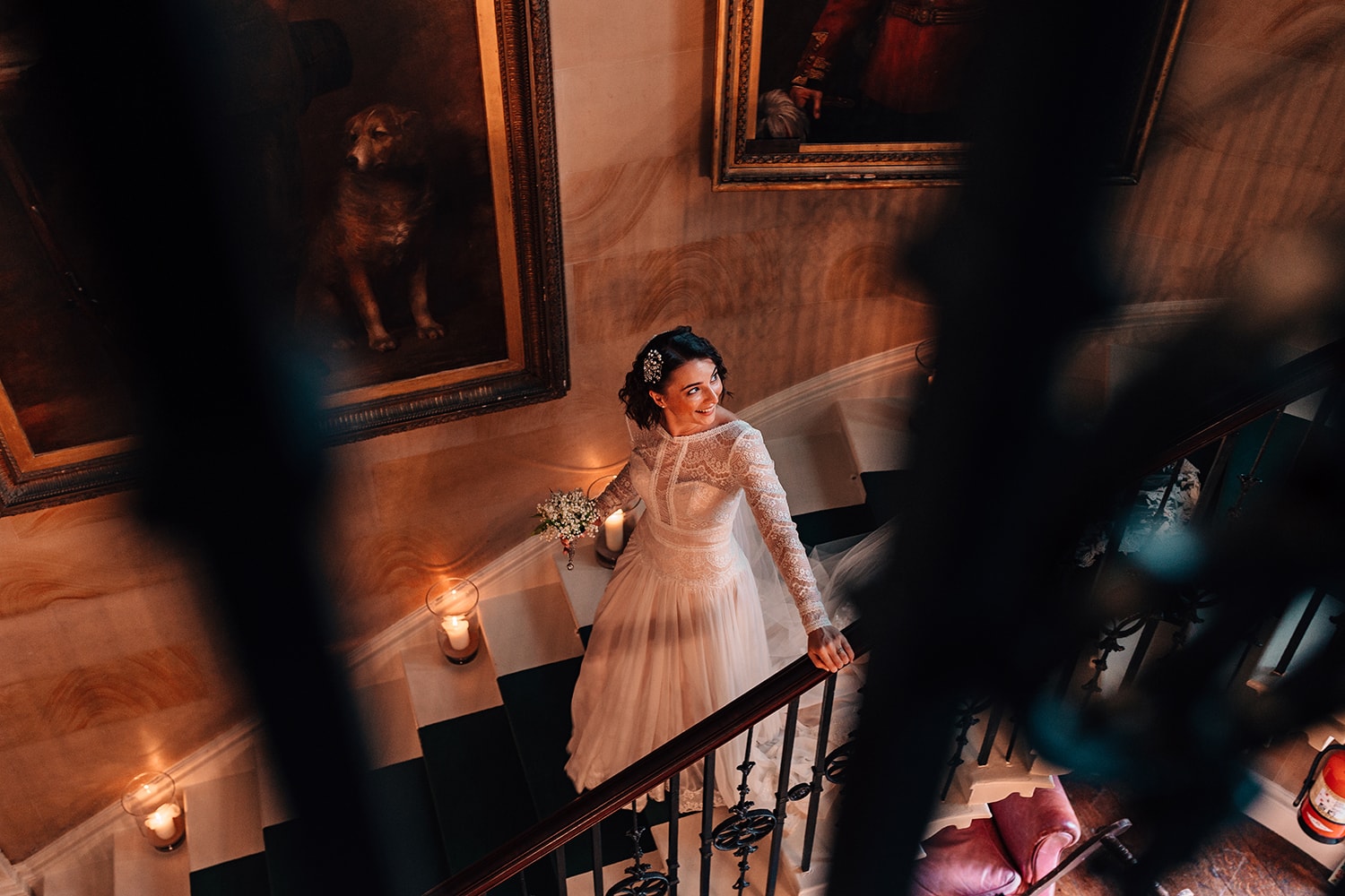 Bride walking down the stairs in Ripley Castle