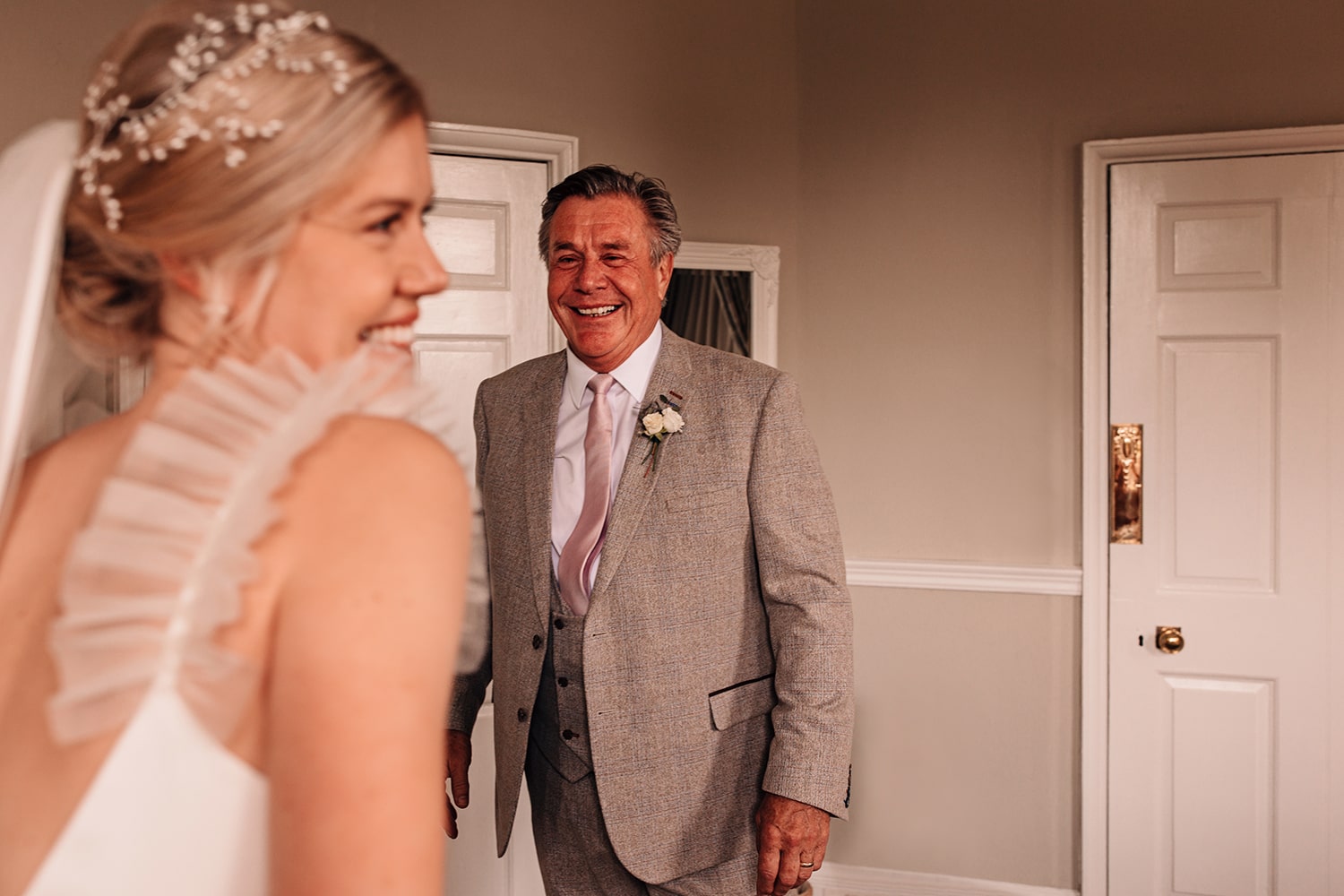 Father of the Bride seeing his daughter in her wedding gown for the first time