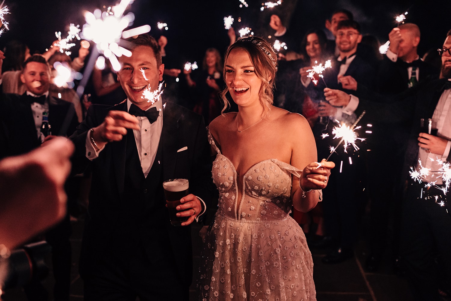 Bride, Groom and guests with sparklers