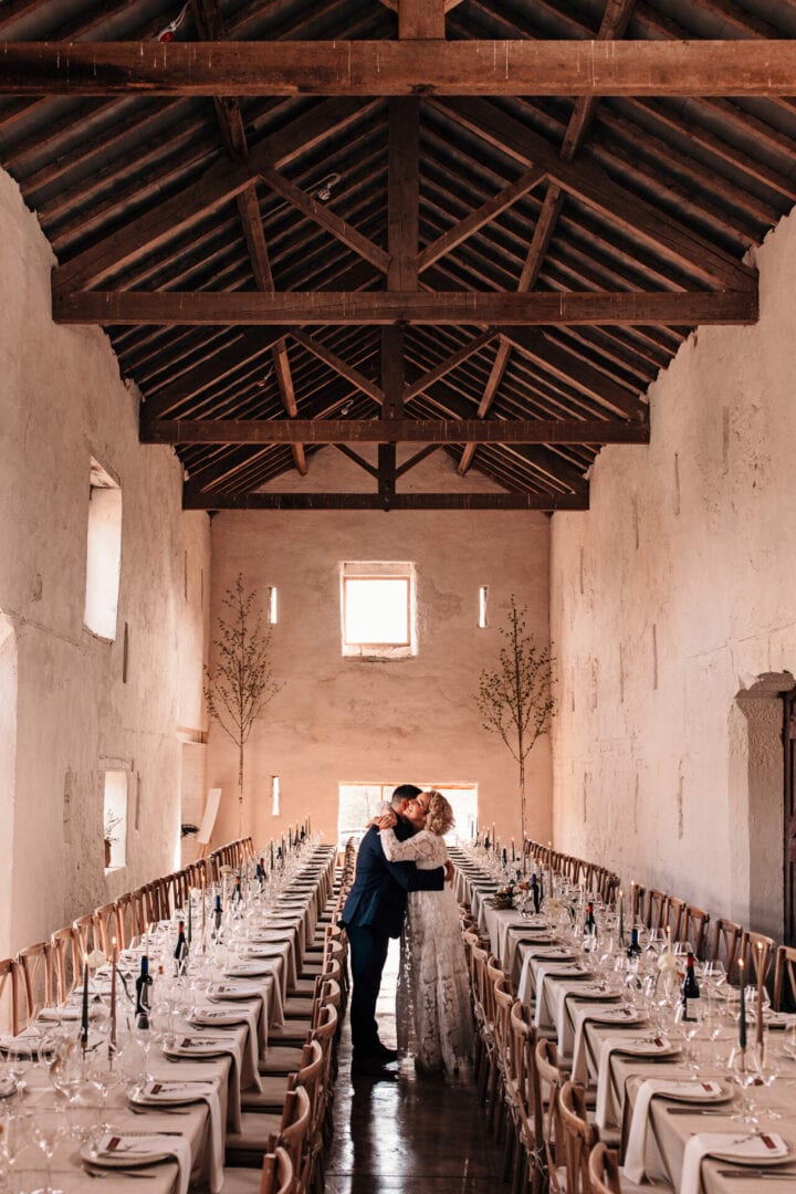 Italian wedding decor inside a traditional white washed wall barn